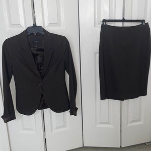 The limited skirt suit. Dark brown